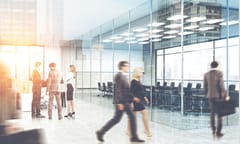 People in business attire in corporate office