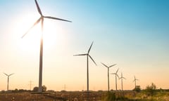 A photo of a row of wind turbines