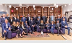 Fieldfisher's new Milan ream photographed together in a library