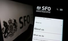 Person holding cellphone with webpage of British agency Serious Fraud Office (SFO) on screen in front of logo.