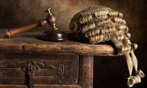 Photos of naked judge removed from website
