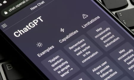 Portland, OR, USA - Dec 18, 2022: Webpage of ChatGPT, a prototype AI chatbot, is seen on the website of OpenAI, on a smartphone. Examples, capabilities, and limitations are shown before a new chat.