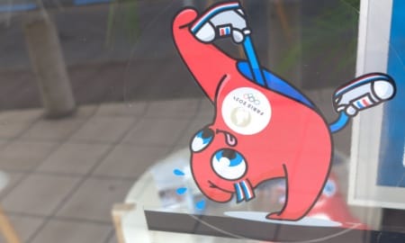 Paris , France - 01 14 2024 : paris 2024 Olympic Games mascot red characters gymnast