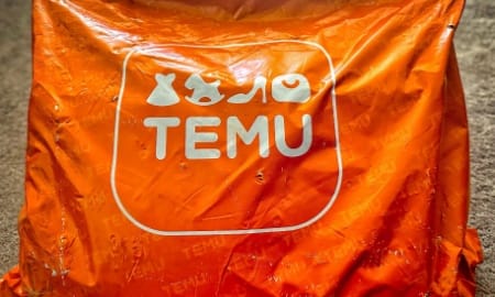 Orange Temu Package close up - Delligsen, Germany, January 15, 2024