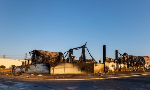 Durban, South Africa, 15 July 2021. A warehouse lies entirely burnt in the aftermath of violent protests that passed through the industrial area north of the city