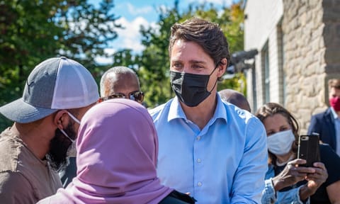 Prime Minister Justin Trudeau greets bystanders after a press conference at the Eva James Memorial Community Centre in Kanata.