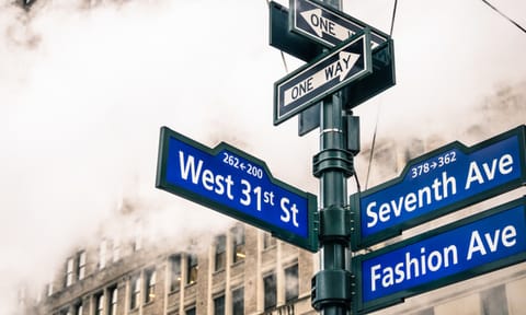 Modern street sign and vapor steam in New York City - Urban concept and road traffic directions in Manhattan downtown - American world famous capital destination on dramatic desaturated filtered look
