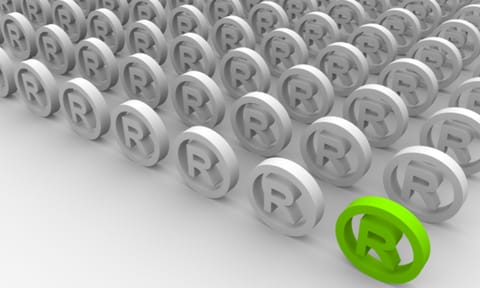 Registered trademark symbols, one is green to symbol a successful registration
