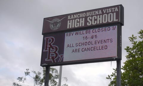 Sign at a California high school announces closure