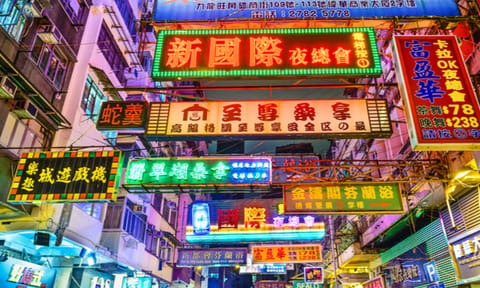 Neon shop signs on a Hong Kong street