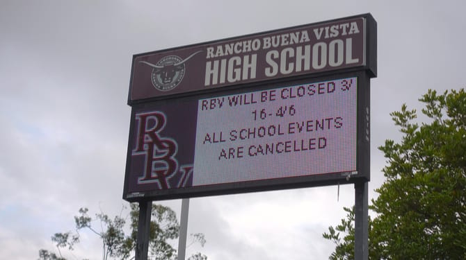 Sign at a California high school announces closure