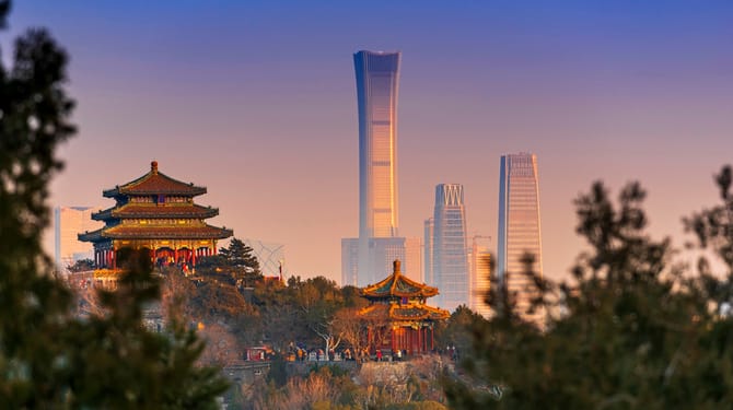 unset Beijing cityscape between ancient chinese architecture. historic buildings and Beijing modern building with sweet sun rise sky, Beijing, China
